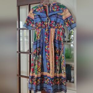 Vintage Louis Caring of London dress in multicolored print. Would fit size 8/10